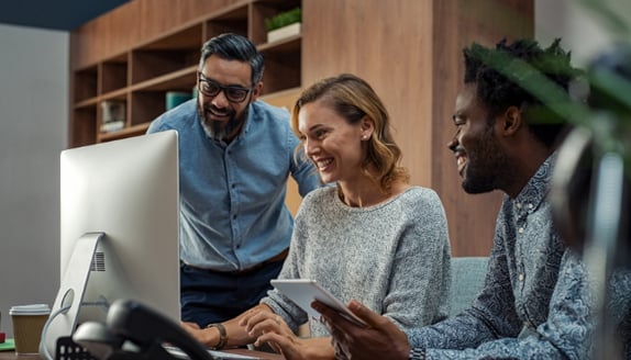 Small business team reviewing financial data and cash flow timing together