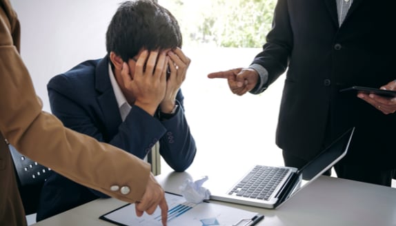 Business owner feeling pressure from cash flow delays and unpaid invoices