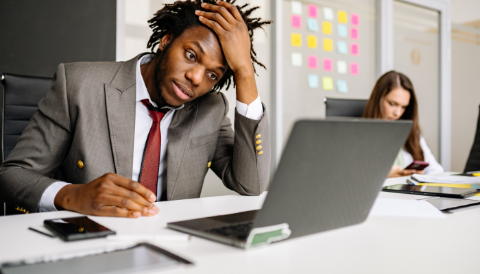 Business professionals reviewing failure rate statistics and financial data and reports