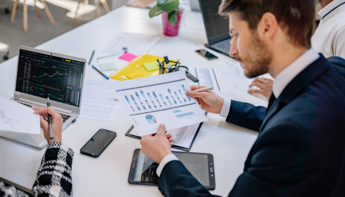 Stressed business owner at laptop recognizing early warning signs of a cash flow problem in his company
