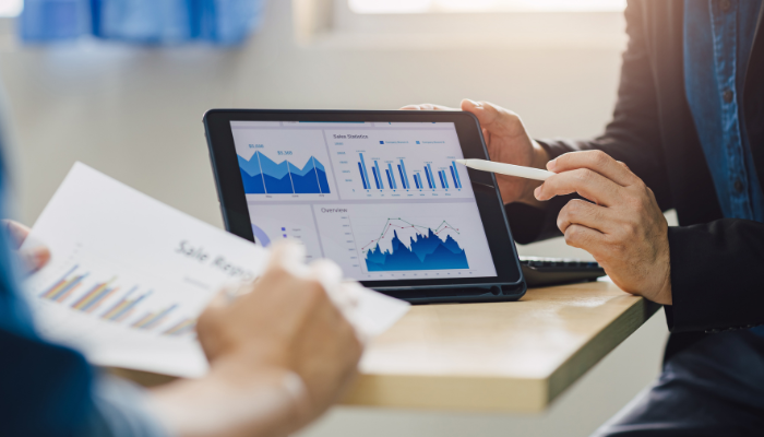Business professionals reviewing financial reports and cash flow strategy to avoid small business failure