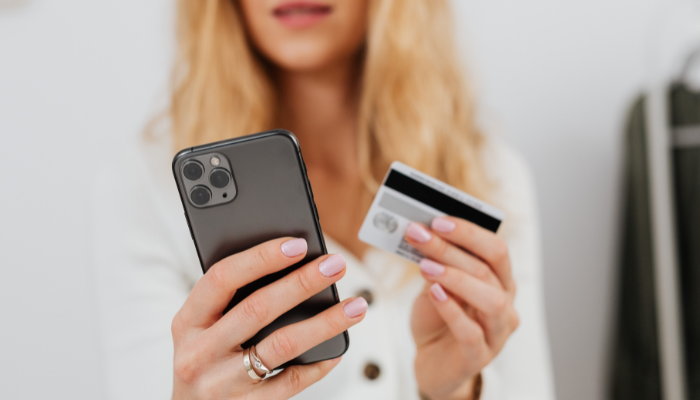A hand placing a puzzle piece into place, representing how business credit fits into a company’s overall financial strategy.