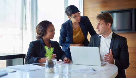 Business team carefully reviewing what to communicate to customers about invoice factoring
