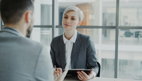 Financial professional explaining a notice of assignment document to a business client