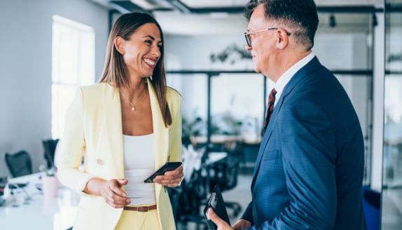Business partners maintaining a strong customer relationship after switching to invoice factoring